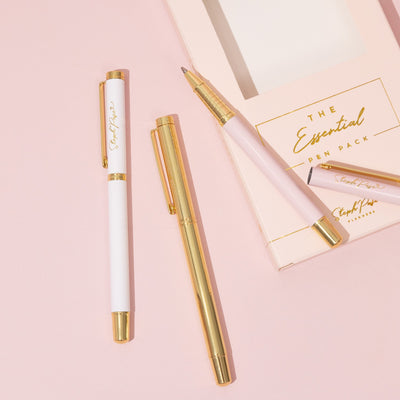 A pack of premium ballpoint pens in white metal, pink metal and gold metal.